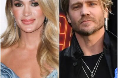 In the quiet light of a hospital room, CARRIE UNDERWOOD KNELT BESIDE A HERO. Before her lay CHAD MILLWARD — THE BRAVE PILOT WHO FLEW INTO THE FLAMES to save others when the world was burning