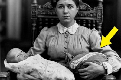 In 1906, a mother holds her baby—until everyone freezes when they see what she is holding